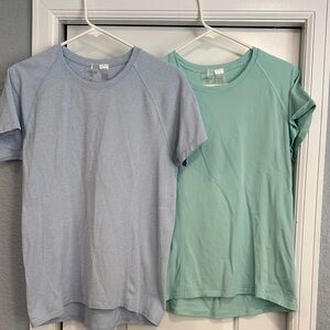 Calla workout t-shirts. TAKE BOTH
Pale blue and light aqua color